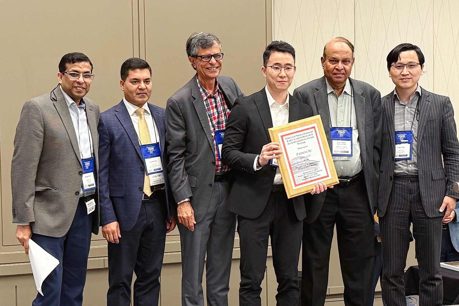 Fasheng Early Career Award Professor Fasheng Yu accepting the 2025 Chelliah Sriskandarajah Early Career Research Accomplishments Award at the POMS Annual conference.